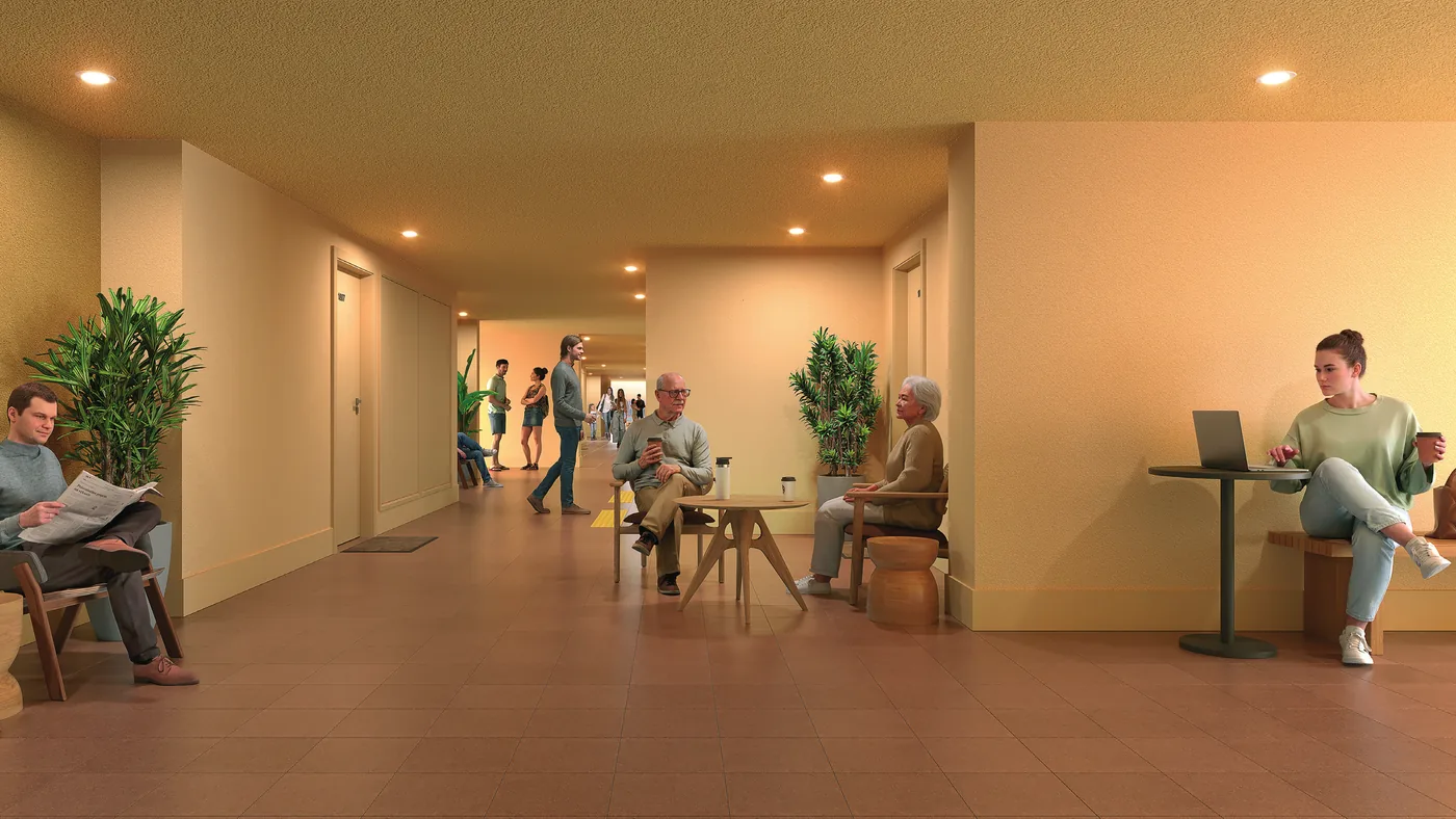 Circulação de encontro do Residencial Erê: corredor alargado com estar e espaço de trabalho, projeto de Isay Weinfeld